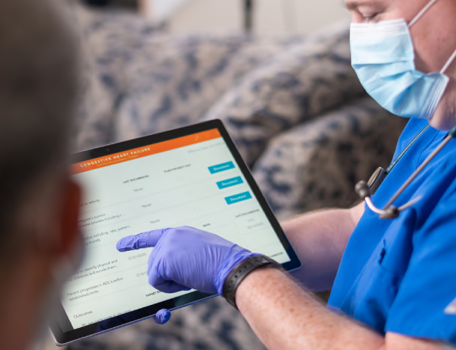 health professional pointing at matrixcare on a ipad